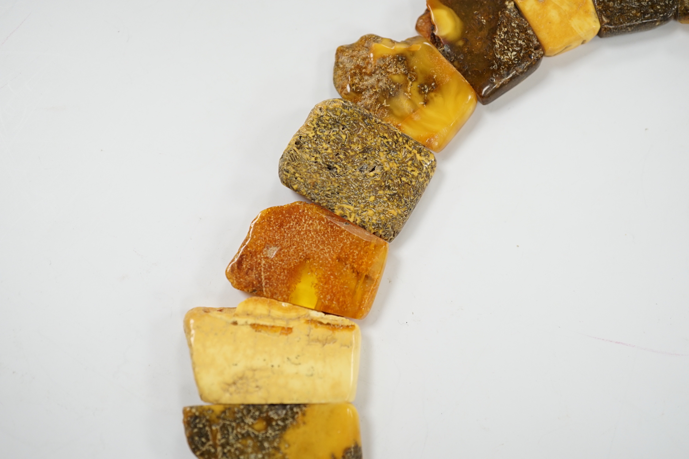 A contemporary Baltic amber fringe necklace, 46cm, gross weight 72 grams.